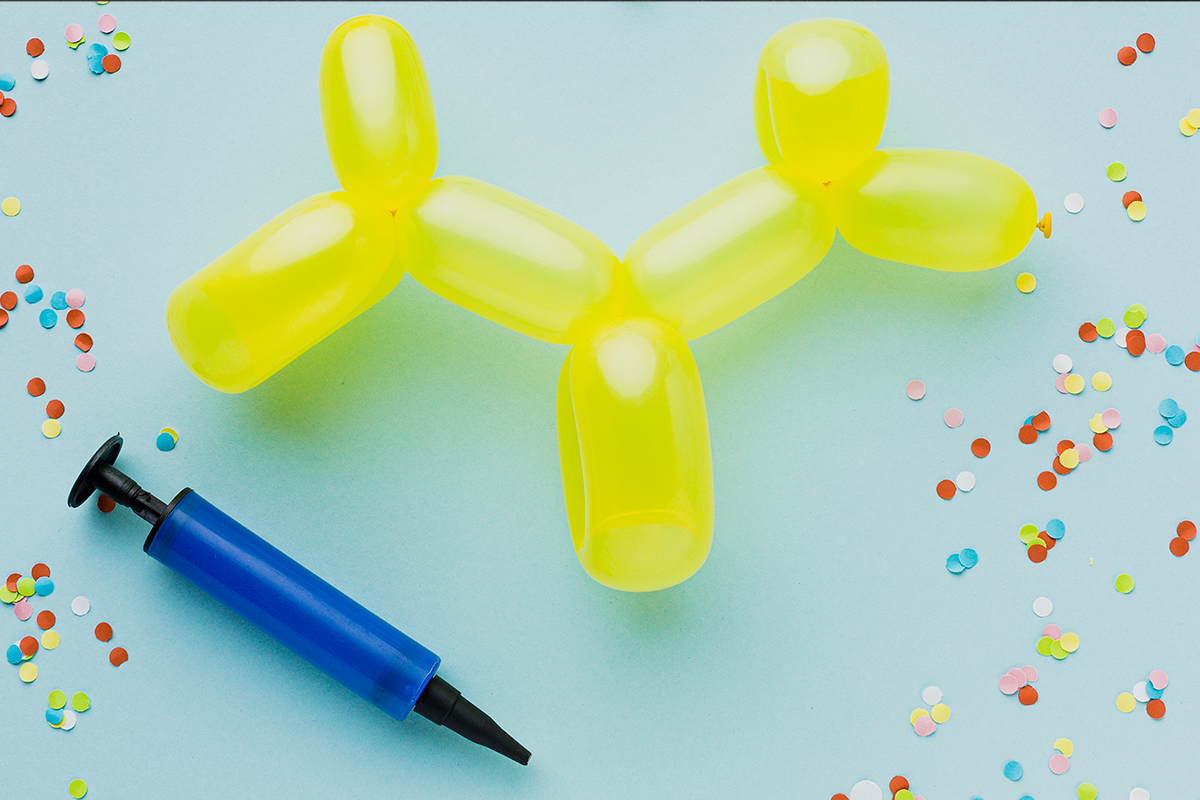 Hand-held balloon pump used for inflating party balloons