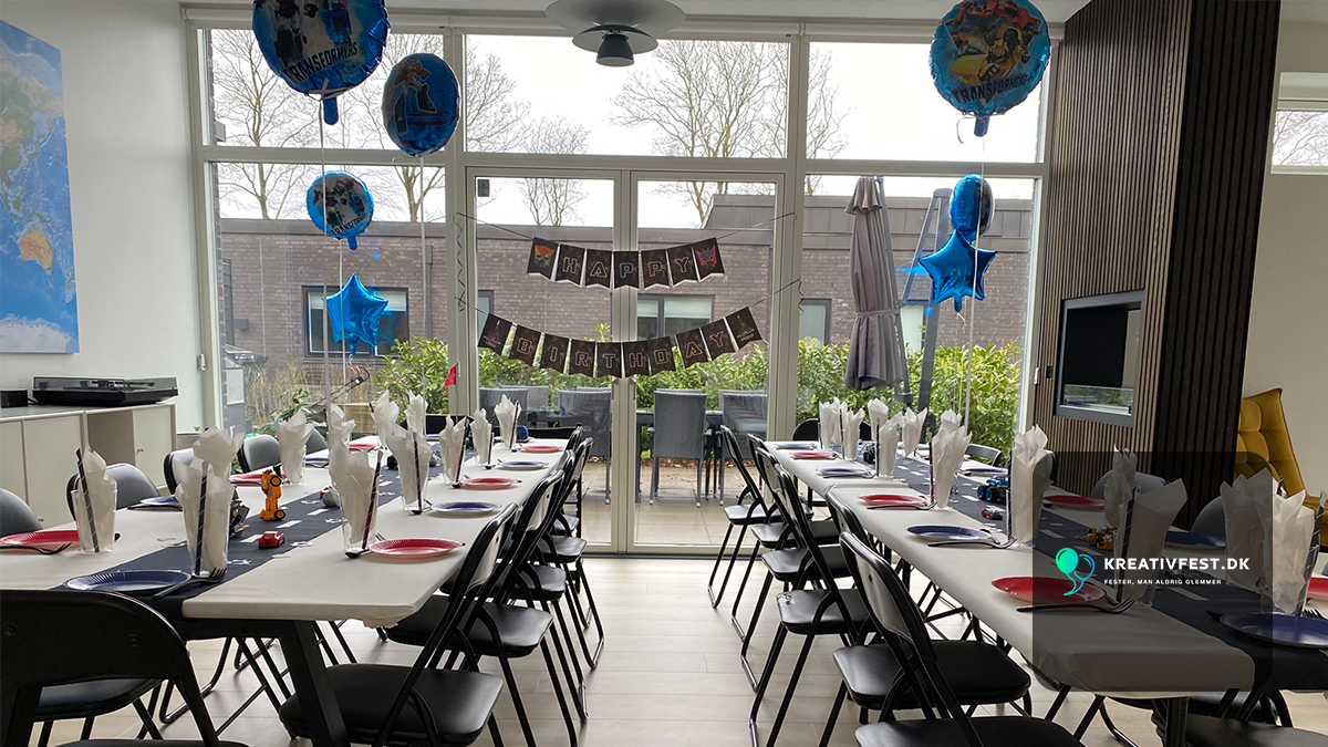 Transformers-themed birthday party table setup in red and blue